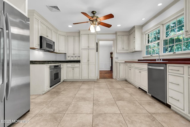 147 Montrose Rd, Colts Neck, NJ 07722 - kitchen with stainless steel appliances, a ceiling fan, dark countertops, light tile patterned flooring, and recessed lighting