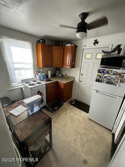 240 Beachwood Blvd, Beachwood, NJ 08722 - kitchen featuring white appliances, a ceiling fan, brown cabinets, and light countertops