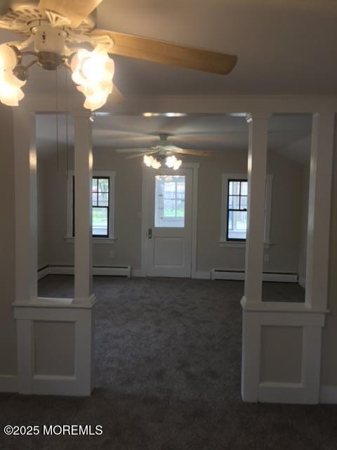 240 Beachwood Blvd, Beachwood, NJ 08722 - foyer with dark colored carpet, healthy amount of natural light, and a baseboard heating unit