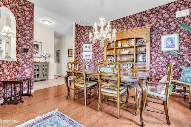 43 Bradley Beach Way, Waretown, NJ 08758 - dining area with wallpapered walls, a chandelier, and wood finished floors