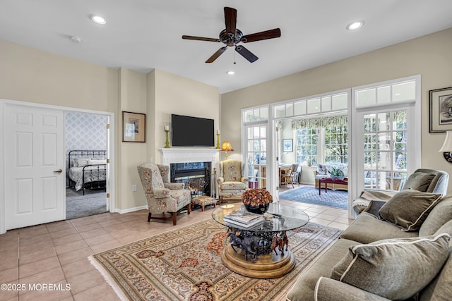 43 Bradley Beach Way, Waretown, NJ 08758 - living area featuring a glass covered fireplace, ceiling fan, tile patterned floors, and recessed lighting