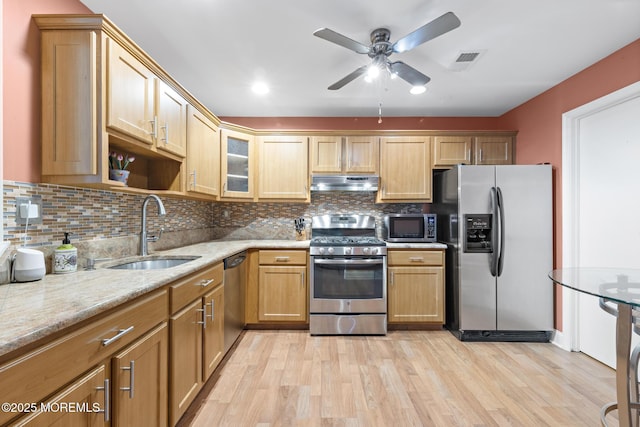 363 Yorkshire Pl, Morganville, NJ 07751 - kitchen with stainless steel appliances, under cabinet range hood, light wood-type flooring, and tasteful backsplash