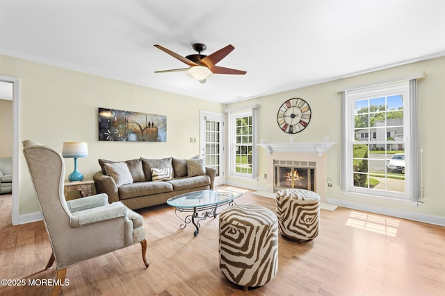 363 Yorkshire Pl, Morganville, NJ 07751 - living room with wood finished floors, ceiling fan, and a fireplace with flush hearth