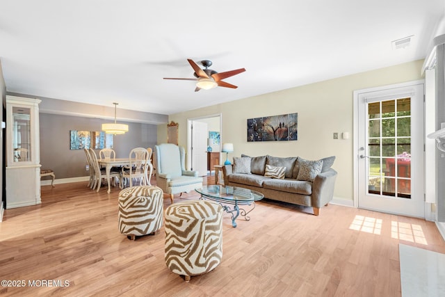 363 Yorkshire Pl, Morganville, NJ 07751 - living area with light wood-type flooring and ceiling fan