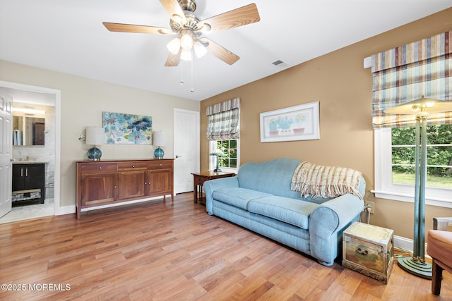 363 Yorkshire Pl, Morganville, NJ 07751 - living room featuring light wood-type flooring, plenty of natural light, and ceiling fan