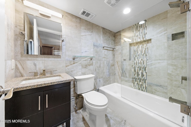 363 Yorkshire Pl, Morganville, NJ 07751 - bathroom featuring tile walls, vanity, and bathtub / shower combination