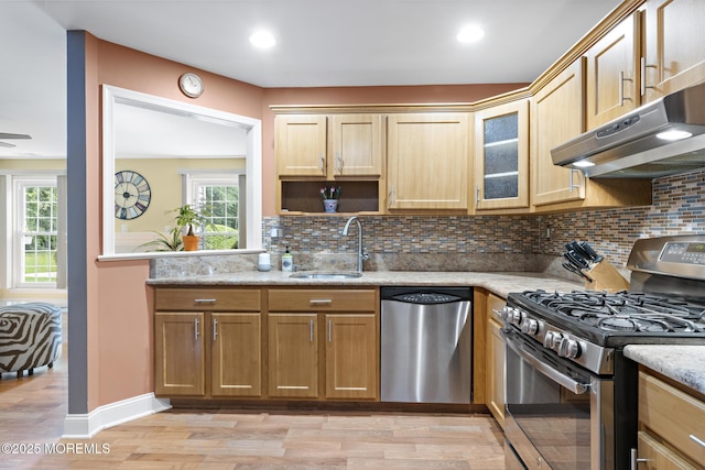 363 Yorkshire Pl, Morganville, NJ 07751 - kitchen featuring appliances with stainless steel finishes, light wood-type flooring, tasteful backsplash, under cabinet range hood, and recessed lighting