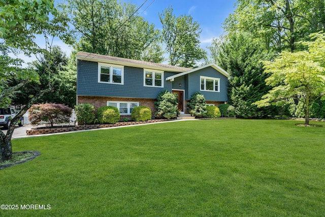 1617 Doris St, Wall, NJ 07719 - raised ranch featuring a front lawn and brick siding
