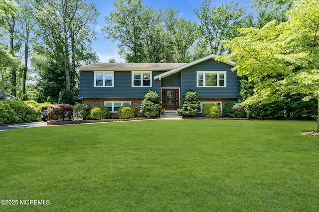 1617 Doris St, Wall, NJ 07719 - split foyer home featuring a front lawn and brick siding