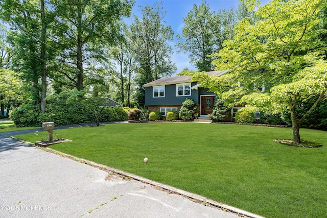 1617 Doris St, Wall, NJ 07719 - raised ranch with a front yard, brick siding, and entry steps