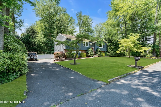 1617 Doris St, Wall, NJ 07719 - bi-level home with asphalt driveway and brick siding