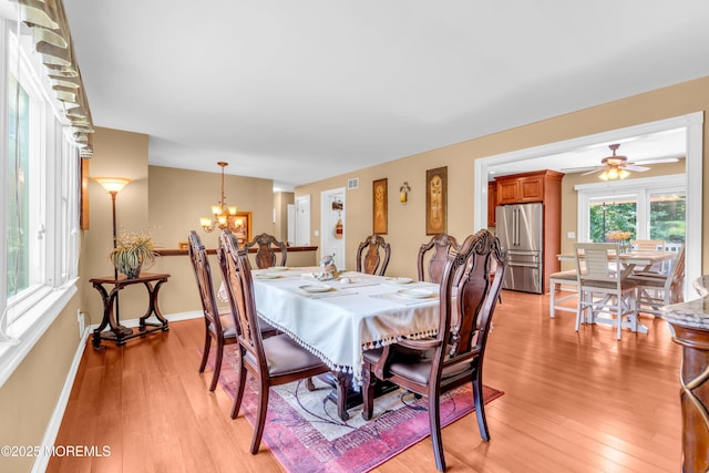 1617 Doris St, Wall, NJ 07719 - dining area with a chandelier, light wood-type flooring, and a ceiling fan
