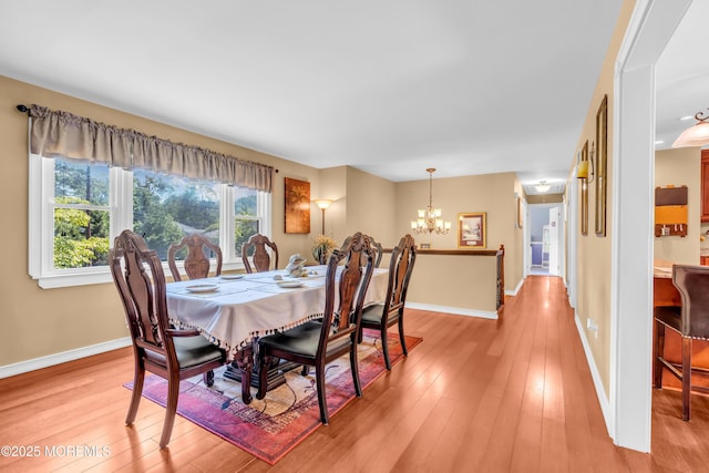 1617 Doris St, Wall, NJ 07719 - dining area with a chandelier and light wood-style floors