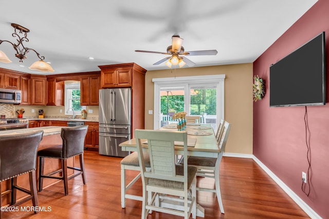 1617 Doris St, Wall, NJ 07719 - kitchen featuring stainless steel appliances, plenty of natural light, a ceiling fan, wood finished floors, and recessed lighting