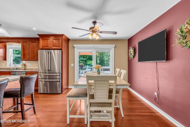 1617 Doris St, Wall, NJ 07719 - kitchen featuring appliances with stainless steel finishes, a ceiling fan, brown cabinets, light wood-style floors, and recessed lighting