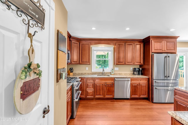 1617 Doris St, Wall, NJ 07719 - kitchen featuring appliances with stainless steel finishes, plenty of natural light, light wood-style floors, light stone counters, and recessed lighting