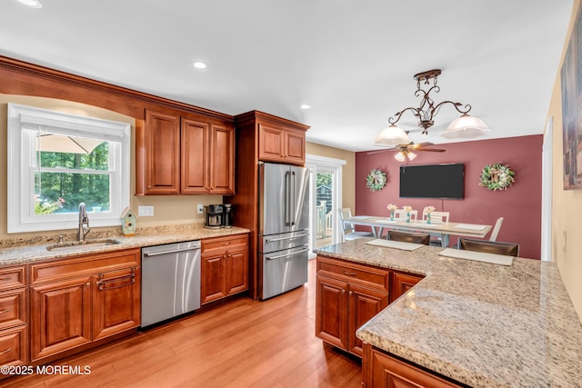 1617 Doris St, Wall, NJ 07719 - kitchen featuring stainless steel appliances, light wood-style flooring, brown cabinetry, a ceiling fan, and recessed lighting