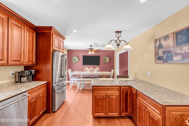 1617 Doris St, Wall, NJ 07719 - kitchen featuring appliances with stainless steel finishes, recessed lighting, a ceiling fan, light wood-type flooring, and brown cabinets