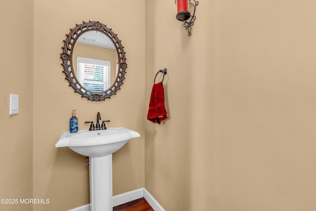 1617 Doris St, Wall, NJ 07719 - bathroom featuring baseboards and a sink