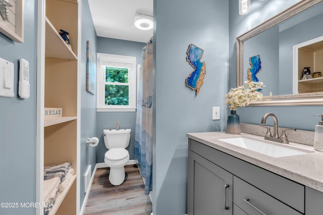 1617 Doris St, Wall, NJ 07719 - full bath with vanity, wood finished floors, and a shower with shower curtain