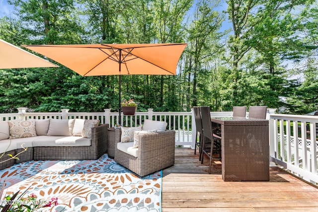 1617 Doris St, Wall, NJ 07719 - wooden deck featuring outdoor lounge area, view of scattered trees, and outdoor dining area
