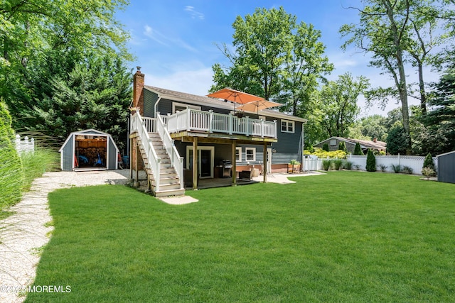 1617 Doris St, Wall, NJ 07719 - rear view of house featuring a storage unit, stairs, a wooden deck, a fenced backyard, and a chimney