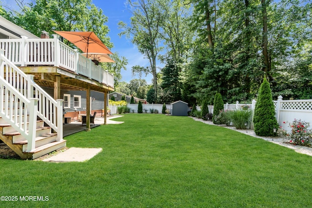 1617 Doris St, Wall, NJ 07719 - fenced backyard with a wooden deck, a shed, and stairs