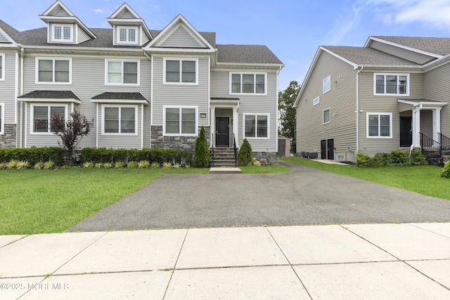 94 Bradhurst Ave, Lakewood, NJ 08701 - townhome / multi-family property with a front yard