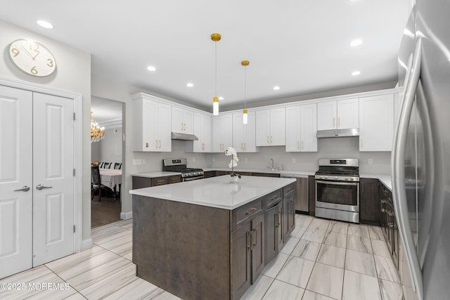 94 Bradhurst Ave, Lakewood, NJ 08701 - kitchen with stainless steel appliances, under cabinet range hood, white cabinetry, light countertops, and recessed lighting