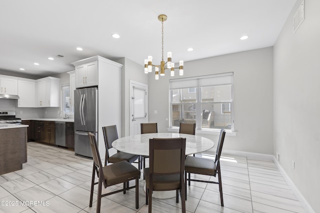 94 Bradhurst Ave, Lakewood, NJ 08701 - dining space featuring a chandelier, recessed lighting, and light tile patterned floors
