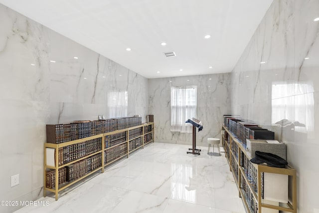 94 Bradhurst Ave, Lakewood, NJ 08701 - misc room featuring marble tiled flooring, recessed lighting, and stone wall