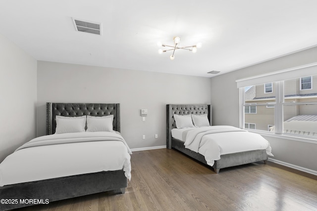 94 Bradhurst Ave, Lakewood, NJ 08701 - bedroom featuring a chandelier and wood finished floors