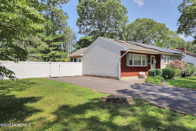 8 N Cherokee Ln, Brick, NJ 08724 - view of home's exterior featuring a gate, solar panels, and driveway