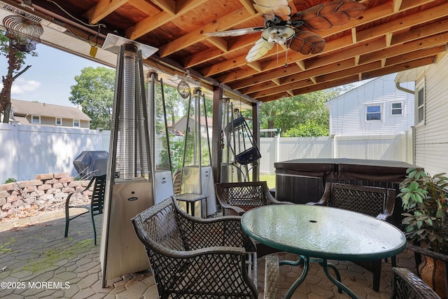 8 N Cherokee Ln, Brick, NJ 08724 - fenced backyard with a hot tub, outdoor dining area, a patio area, ceiling fan, and area for grilling