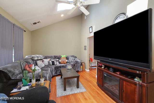 8 N Cherokee Ln, Brick, NJ 08724 - living room featuring lofted ceiling, light wood finished floors, a ceiling fan, and a skylight