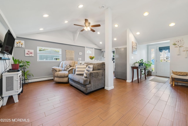1417 Beach Blvd, Forked River, NJ 08731 - living area with lofted ceiling, ceiling fan, a baseboard heating unit, light wood finished floors, and recessed lighting