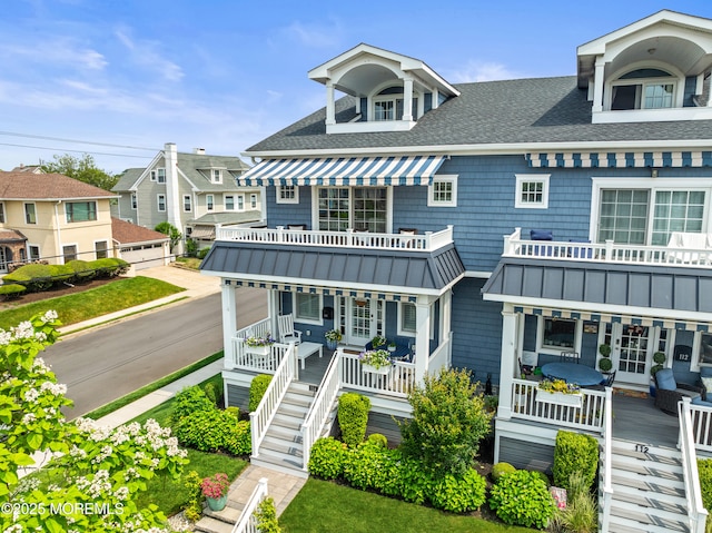 114 3rd Ave, Bradley Beach, NJ 07720 - view of front facade featuring a porch, a standing seam roof, roof with shingles, a metal roof, and a residential view