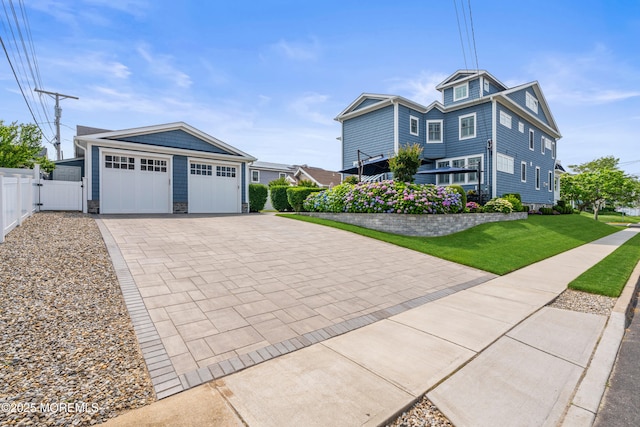114 3rd Ave, Bradley Beach, NJ 07720 - view of front of house featuring a garage, driveway, and stone siding