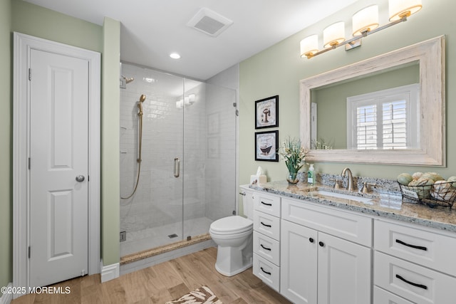114 3rd Ave, Bradley Beach, NJ 07720 - bathroom featuring vanity, wood finished floors, a stall shower, and recessed lighting