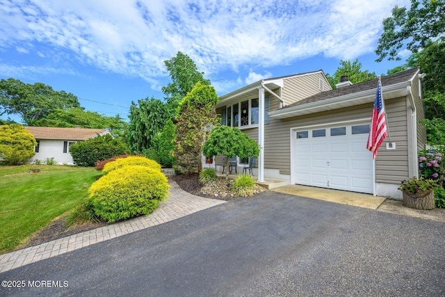 2 Darien Cir, Howell, NJ 07731 - view of front of home featuring an attached garage, a front yard, driveway, and a chimney