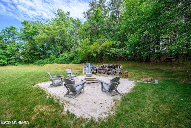2 Darien Cir, Howell, NJ 07731 - view of green lawn with a fire pit and a patio area