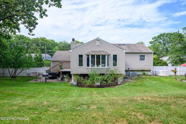 2 Darien Cir, Howell, NJ 07731 - back of house with a fenced backyard, a chimney, a patio, and roof with shingles