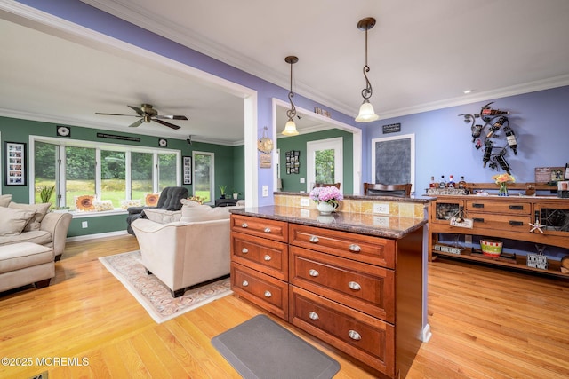 2 Darien Cir, Howell, NJ 07731 - kitchen featuring open floor plan, plenty of natural light, ornamental molding, light wood-type flooring, and decorative light fixtures