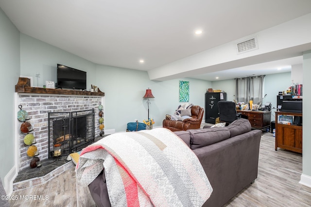 2 Darien Cir, Howell, NJ 07731 - living area with light wood-style flooring, a brick fireplace, and recessed lighting