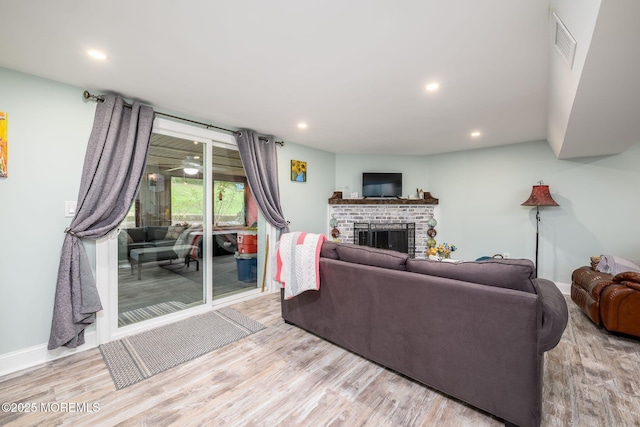 2 Darien Cir, Howell, NJ 07731 - living room featuring wood finished floors, a fireplace, and recessed lighting