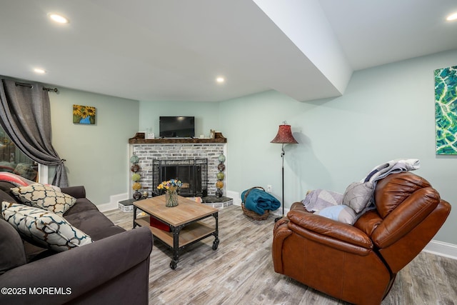 2 Darien Cir, Howell, NJ 07731 - living room with wood finished floors, a fireplace, and recessed lighting