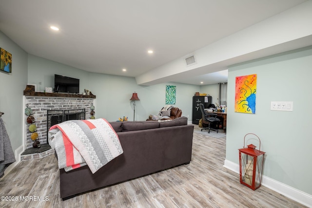 2 Darien Cir, Howell, NJ 07731 - living room with wood finished floors, a brick fireplace, recessed lighting, and an office area