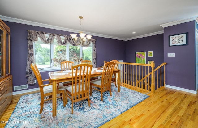 2 Darien Cir, Howell, NJ 07731 - dining area with a chandelier, light wood finished floors, and crown molding