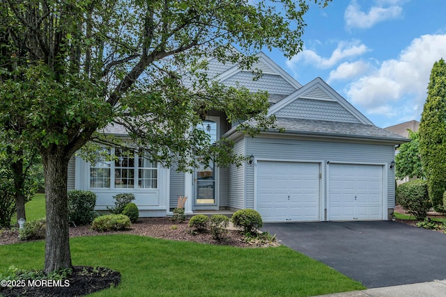 12 Drayton Rd, Manchester, NJ 08759 - view of front facade with driveway, a garage, a front lawn, and roof with shingles