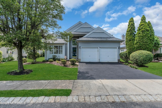12 Drayton Rd, Manchester, NJ 08759 - single story home with a garage, asphalt driveway, a front lawn, and roof with shingles
